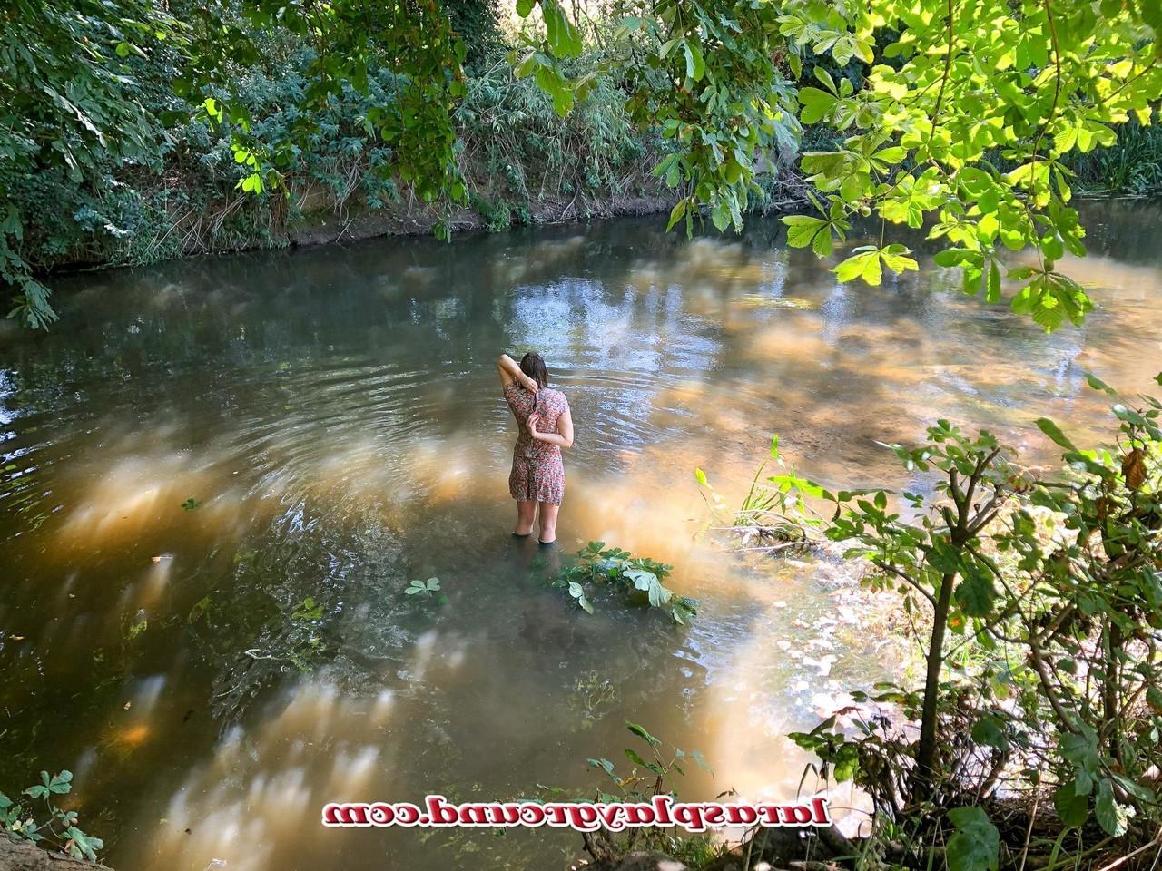 20P Horny British MILF Lara posing pantyless in her rubber boots in the river