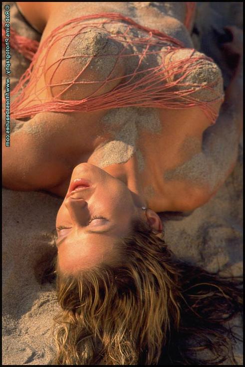 15P Fitness model Jennifer Chamberlin poses in a bikini and lingerie on a beach