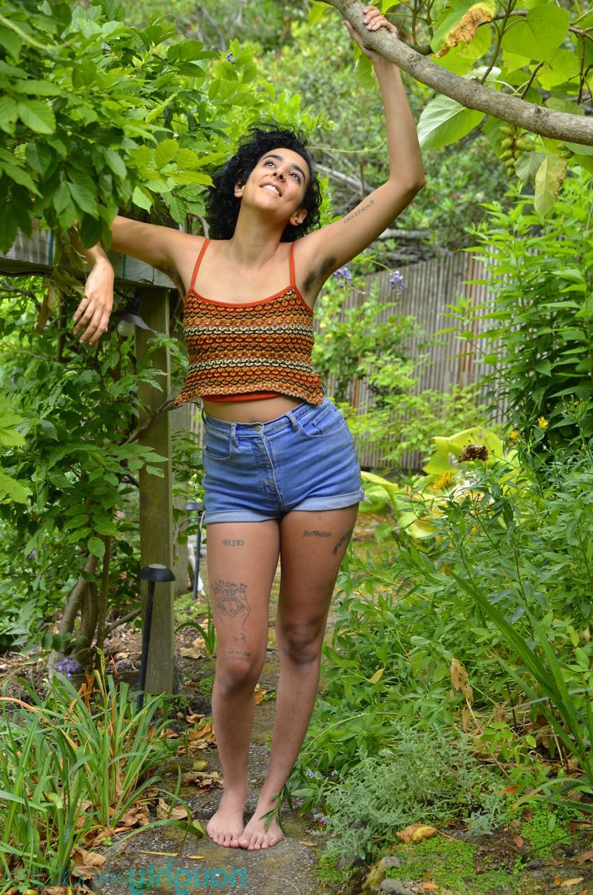 20P Curly haired amateur Grace strips fully naked to show her inviting hairy pussy