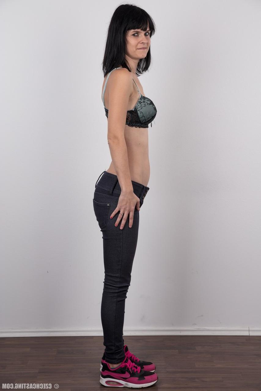20P Burnett amateur models fully clothed before a close-up of her naked pussy
