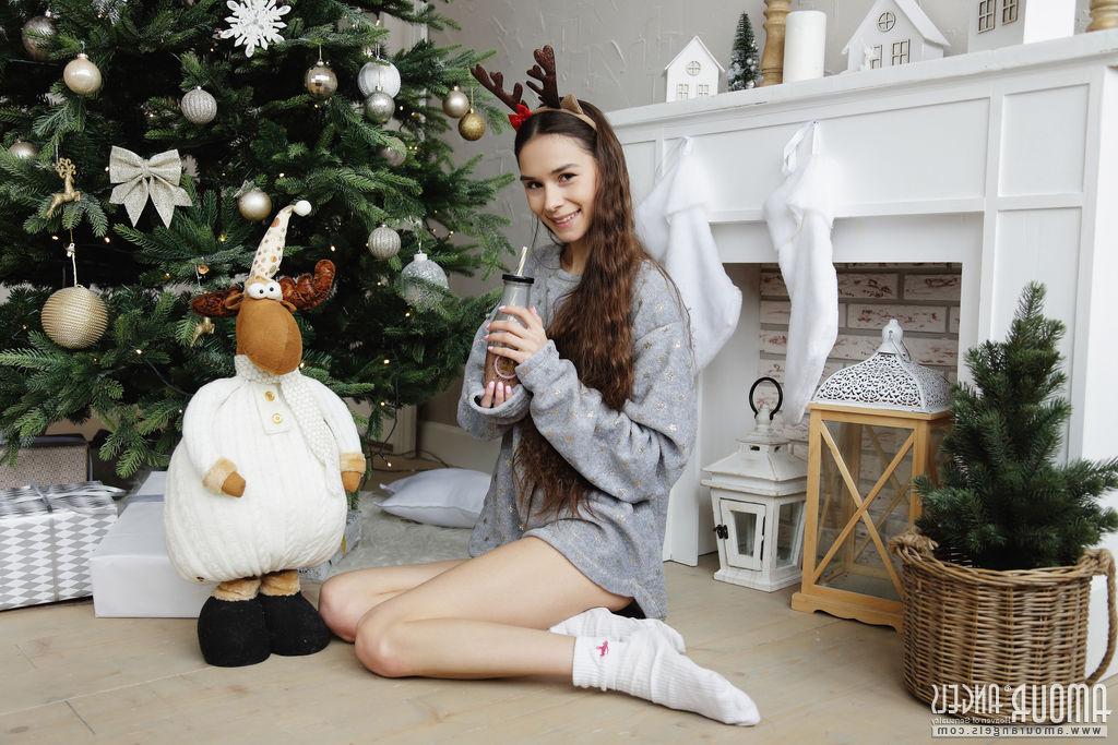 20P Young girl with a fresh face Leona Mia gets naked in front of a Christmas tree