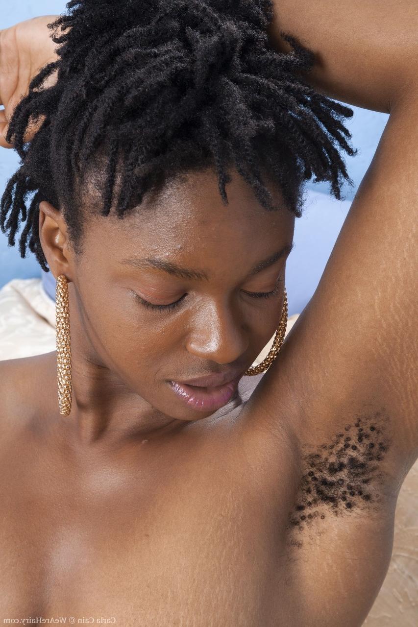 20P Ebony with dreads Carla Cain shows her big ass and hairy pussy in a solo