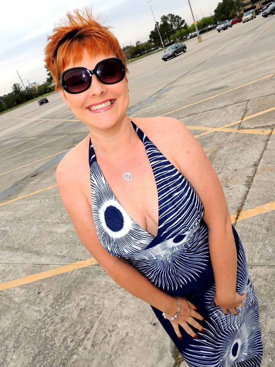 17P Middle-aged lady with short red hair Kali Devine gives a BJ in a dressing room