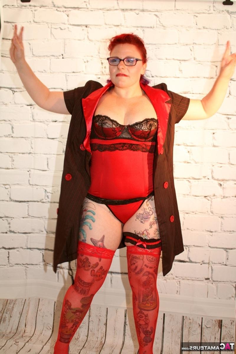 16P Older redhead pulls out a gun while wearing lingerie and stockings
