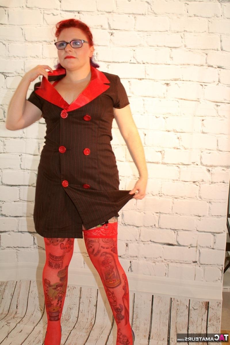 16P Older redhead pulls out a gun while wearing lingerie and stockings