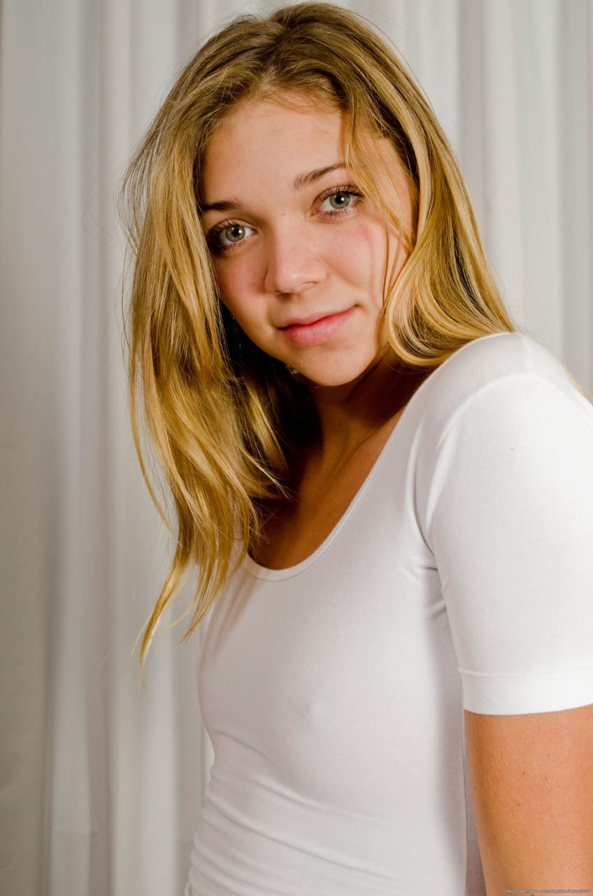 20P Fit babe Jessie Andrews twists her tiny titties and poses naked on a chair