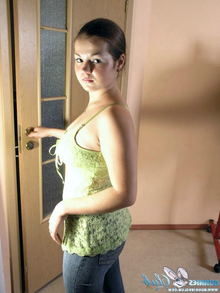20P Young brunette Bea pulls on a pair of jeans after getting naked to change