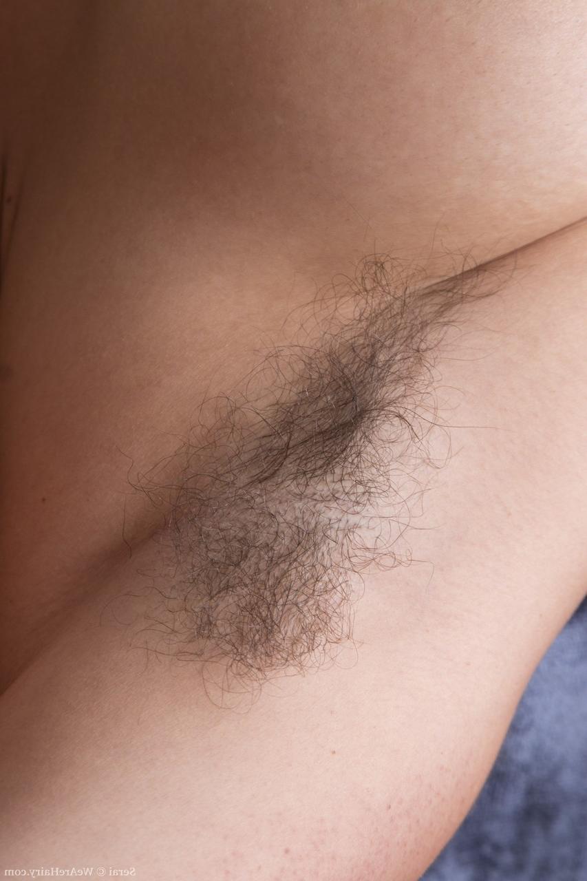 18P Dark haired babe with big tits Serai teasing her hairy vagina in a solo