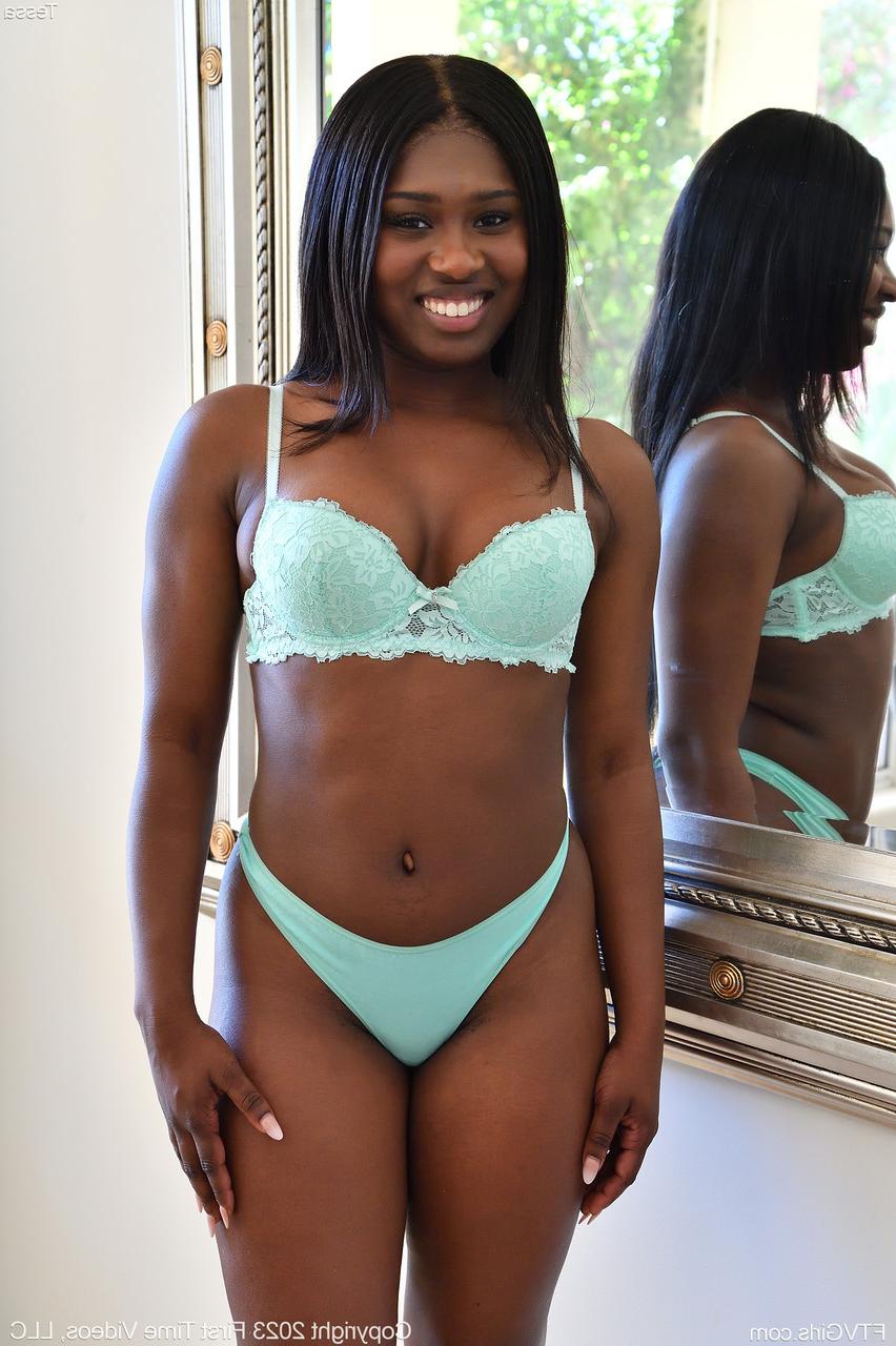 20P Cute ebony babe Tessa stripping and masturbating in front of the mirror