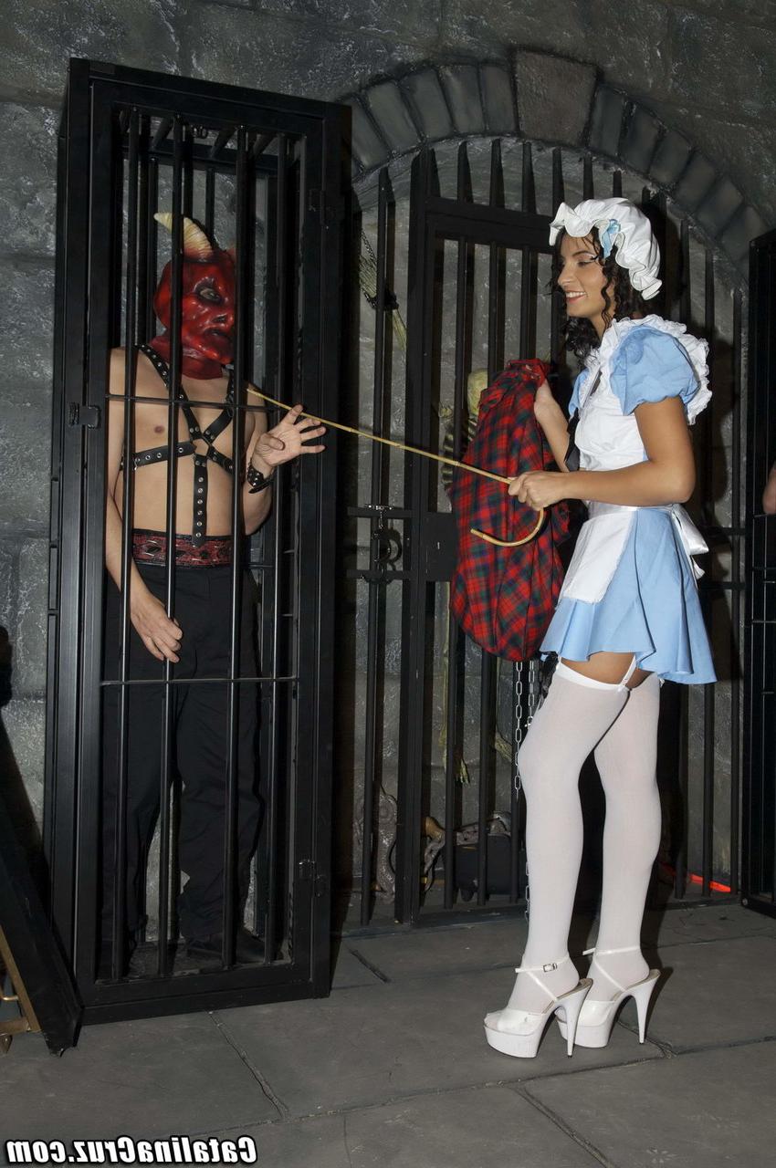 20P Sweet babe in a costume Lucy Belle gets fucked by two masked men in a dungeon