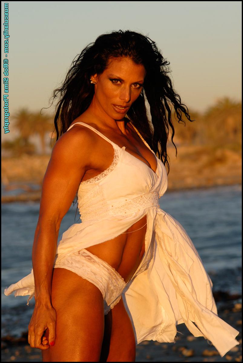15P Brunette bodybuilder Deidre Pagnanelli models at the ocean for a SFW gig