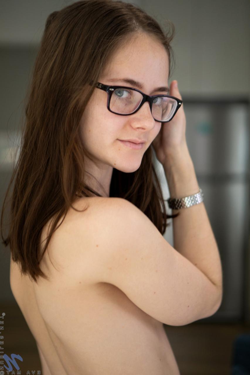 20P Petite MILF in glasses Eva May strips naked & spreads her inviting hairy pussy