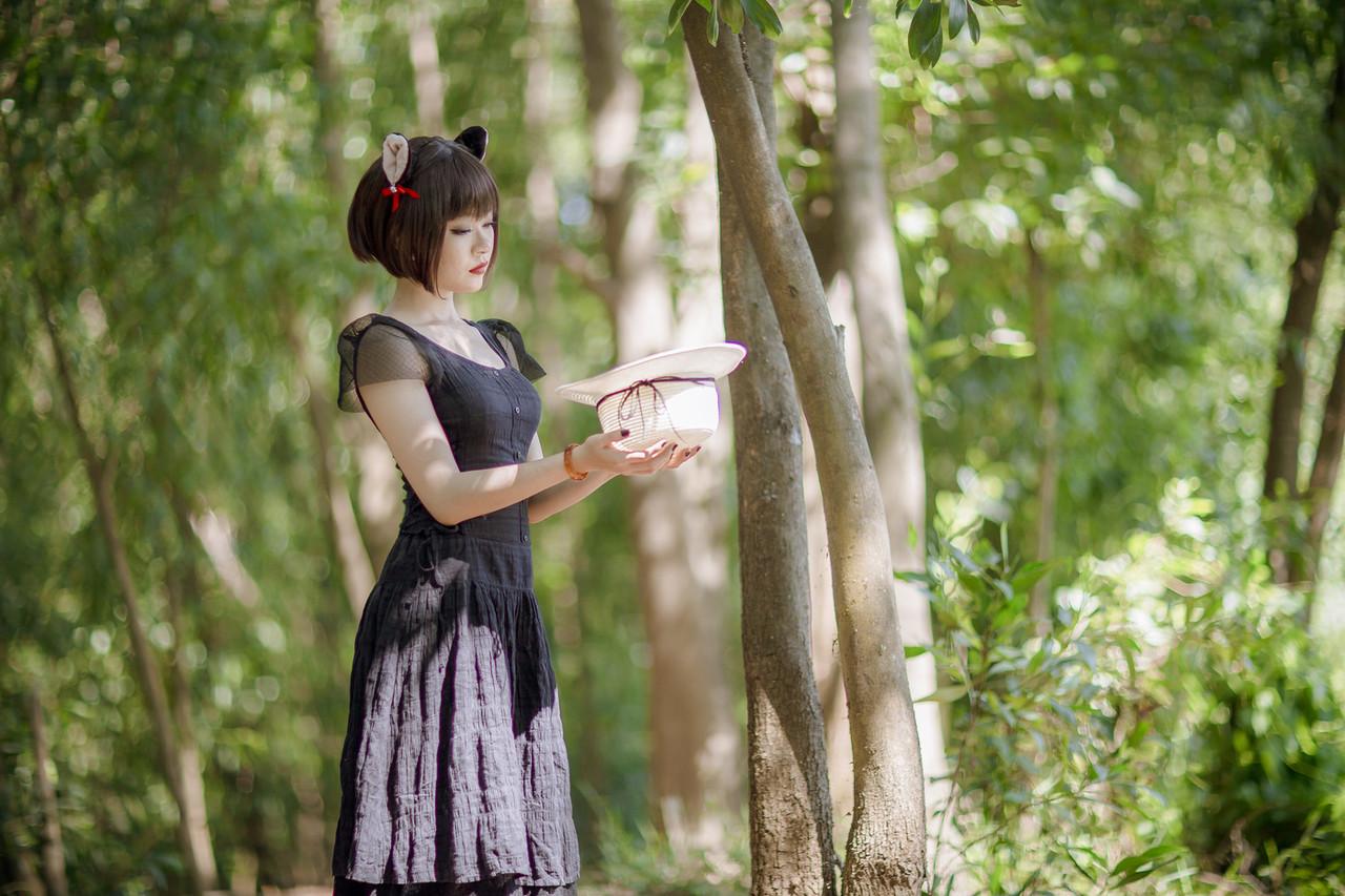 20P Pretty Asian model posing in her elegant black dress in the forest