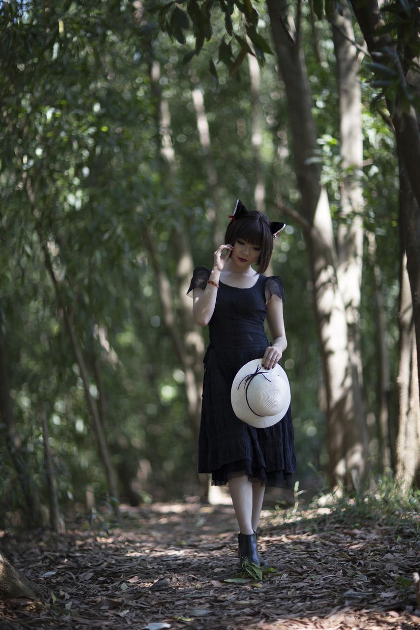20P Pretty Asian model posing in her elegant black dress in the forest