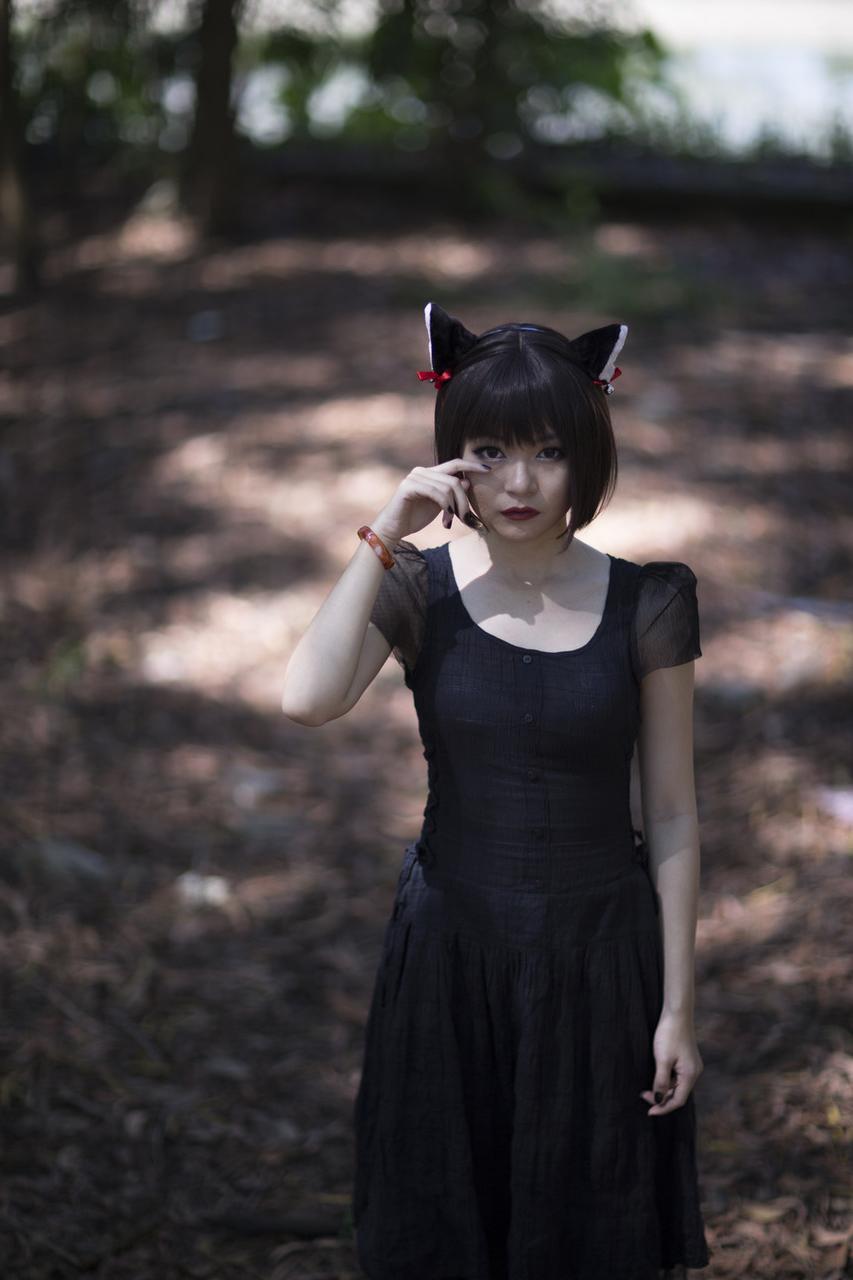 20P Pretty Asian model posing in her elegant black dress in the forest