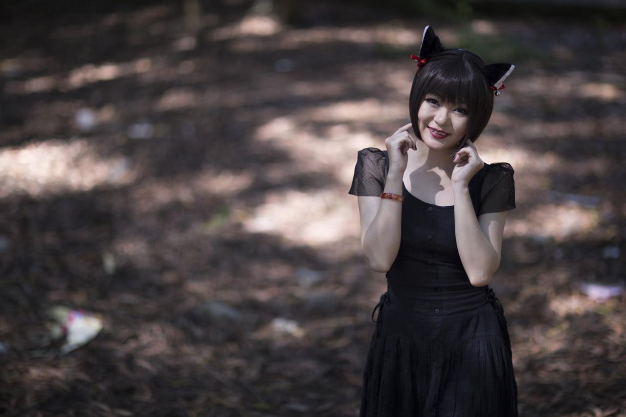 20P Pretty Asian model posing in her elegant black dress in the forest