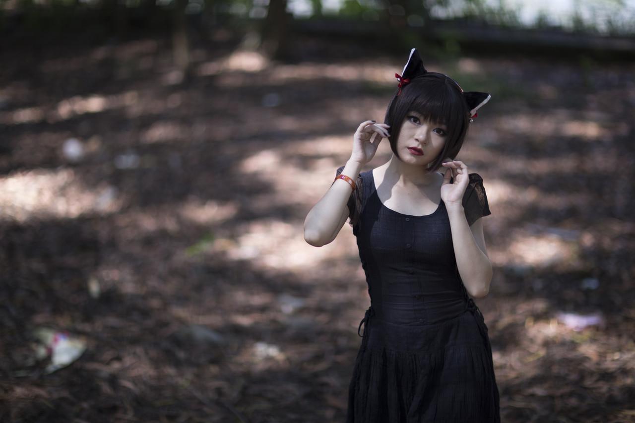20P Pretty Asian model posing in her elegant black dress in the forest