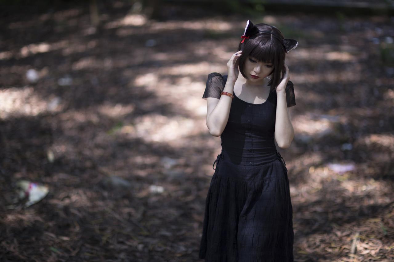 20P Pretty Asian model posing in her elegant black dress in the forest