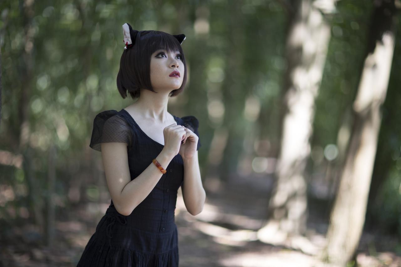 20P Pretty Asian model posing in her elegant black dress in the forest