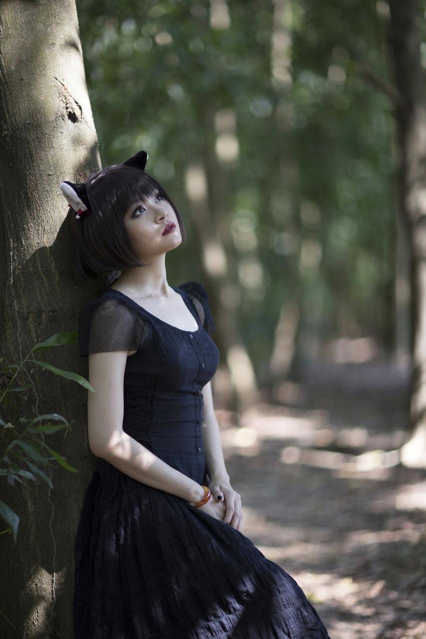 20P Pretty Asian model posing in her elegant black dress in the forest