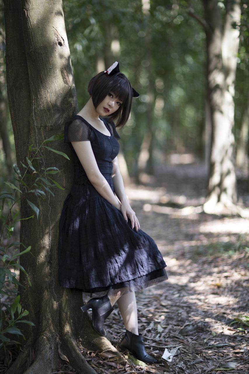 20P Pretty Asian model posing in her elegant black dress in the forest