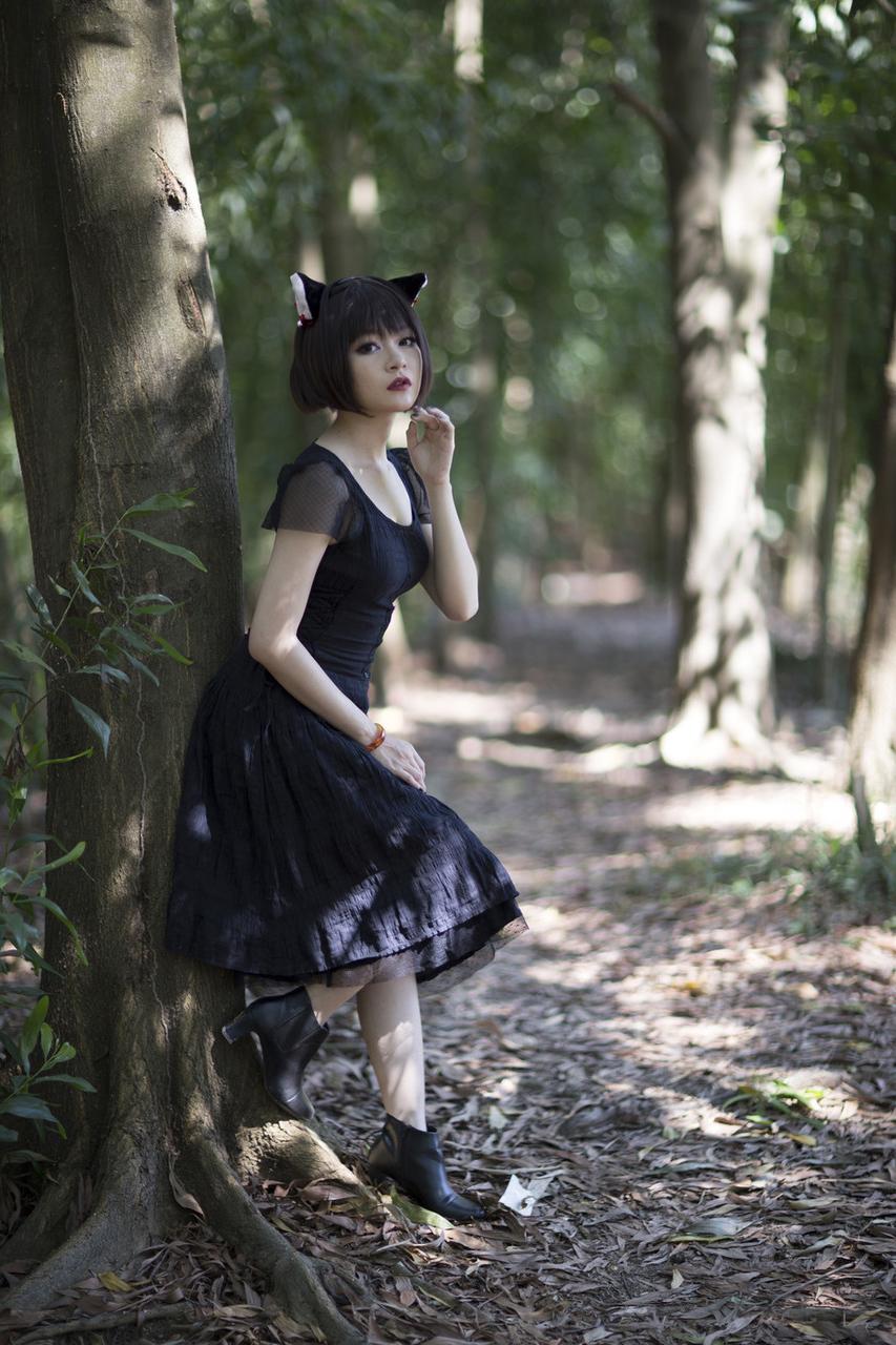 20P Pretty Asian model posing in her elegant black dress in the forest