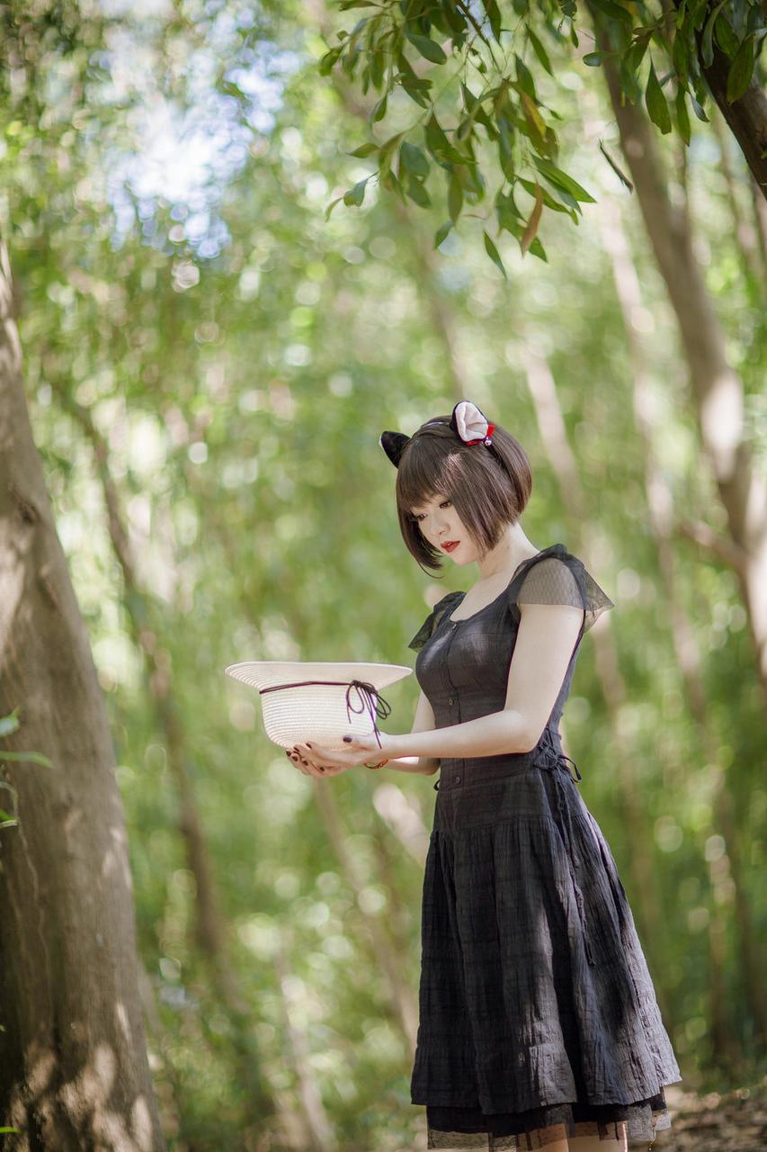 20P Pretty Asian model posing in her elegant black dress in the forest