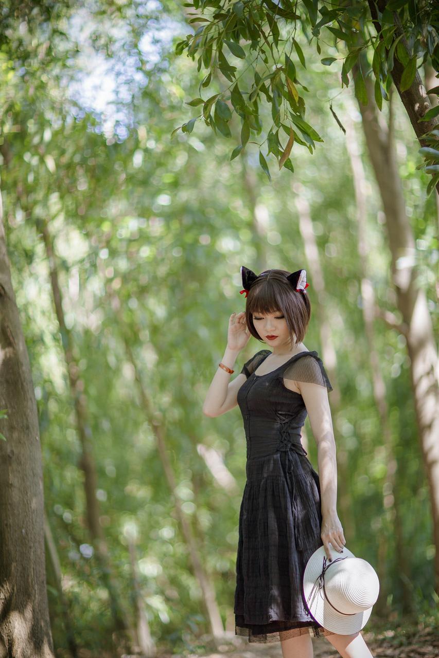 20P Pretty Asian model posing in her elegant black dress in the forest
