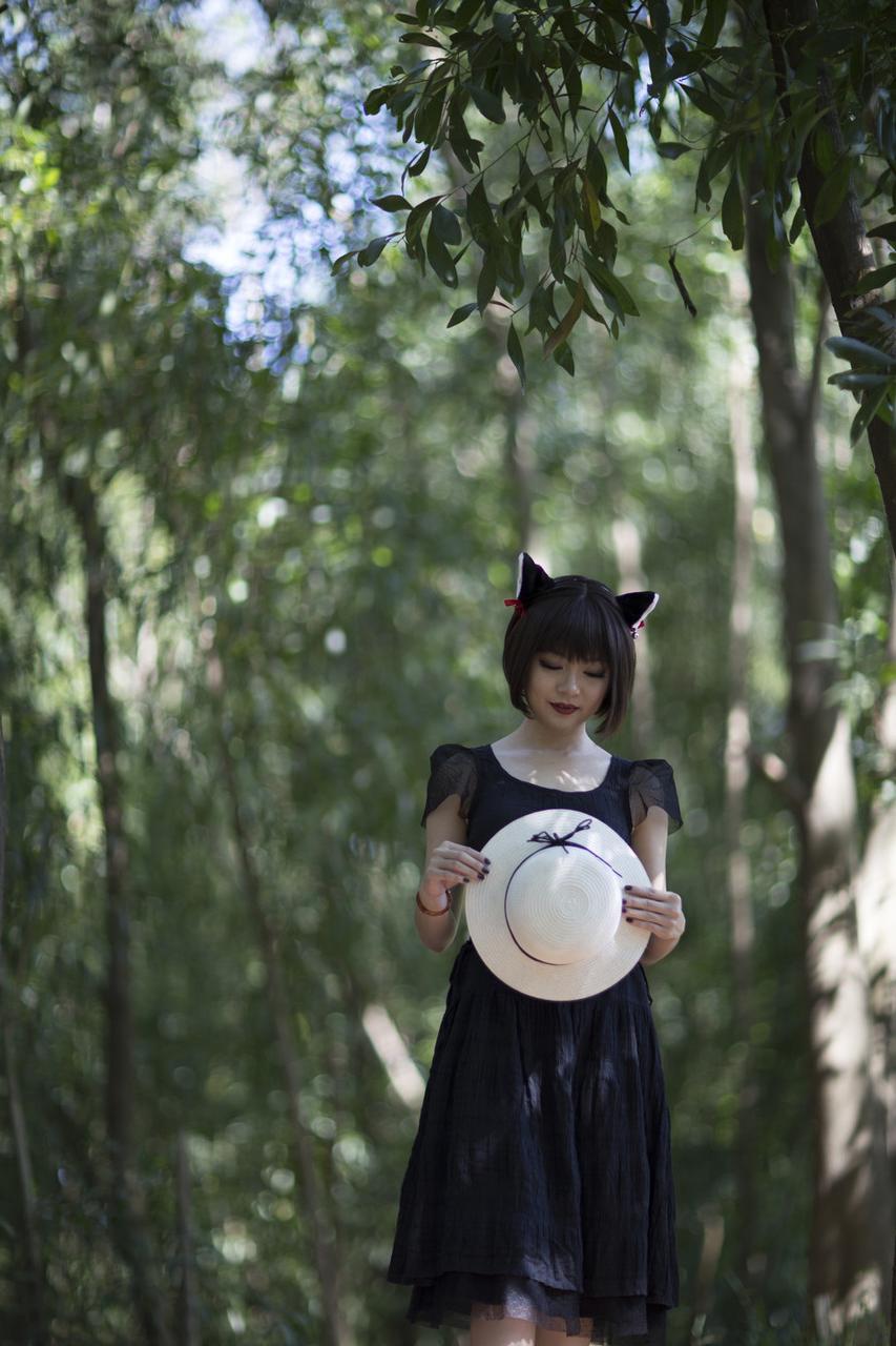 20P Pretty Asian model posing in her elegant black dress in the forest