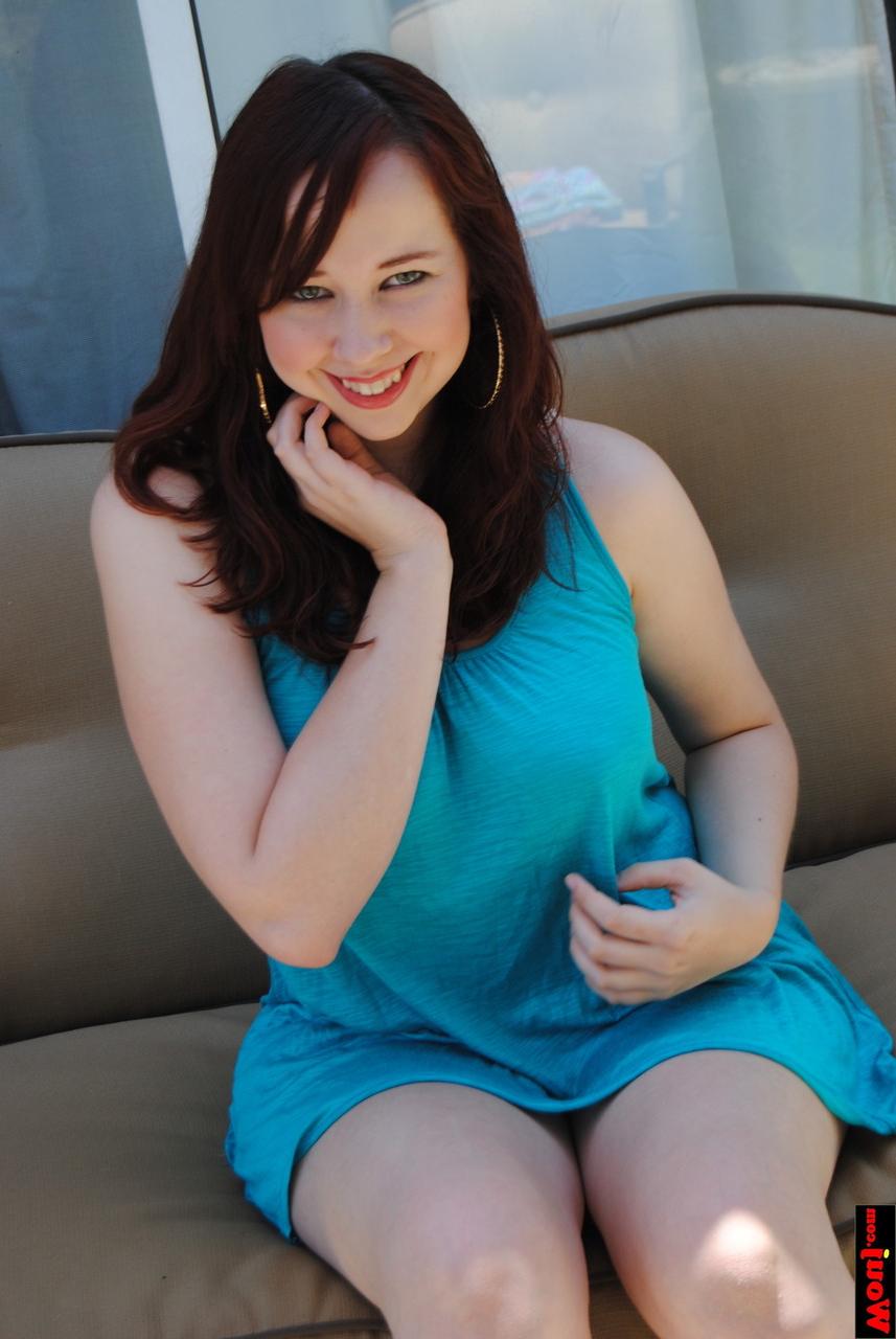15P Chubby brunette amateur posing in her gorgeous blue dress on the sofa