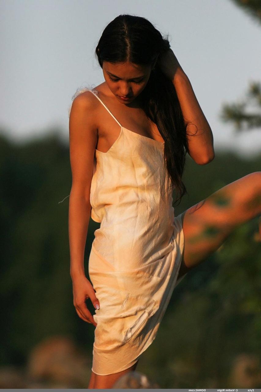 20P Exotic teen babe Zyta stripping in nature & exposing her tanned body