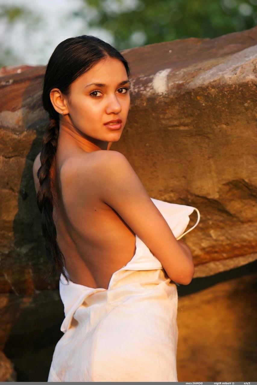 20P Exotic teen babe Zyta stripping in nature & exposing her tanned body