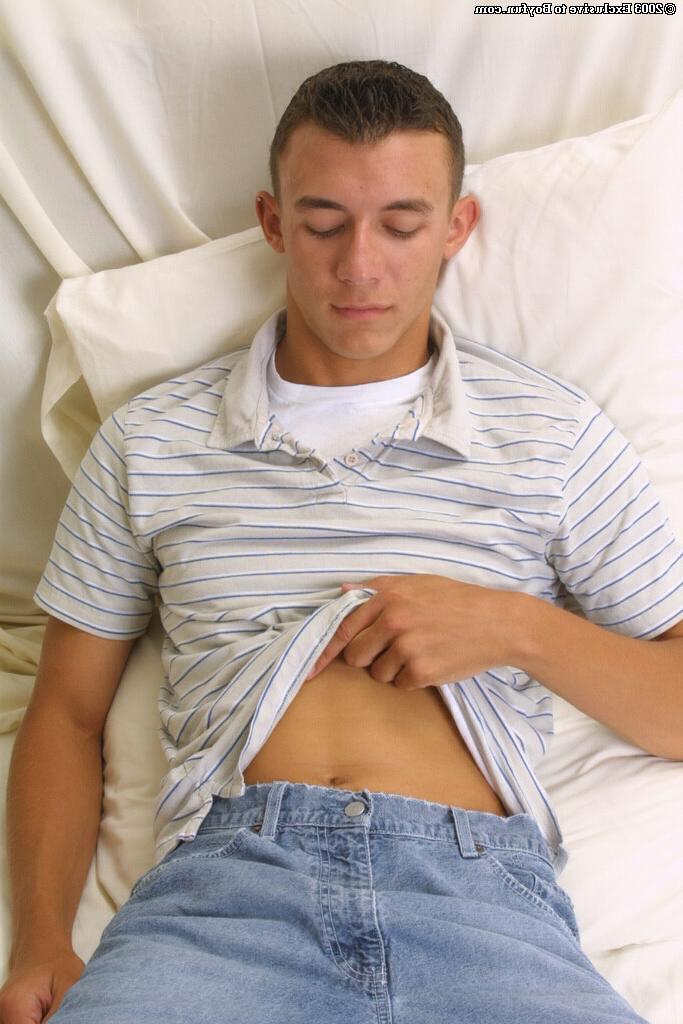 20P Gay brunette Dan loses his clothes and jerks off his massive dick in a solo