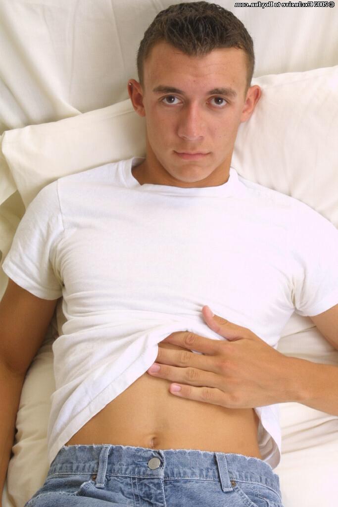 20P Gay brunette Dan loses his clothes and jerks off his massive dick in a solo