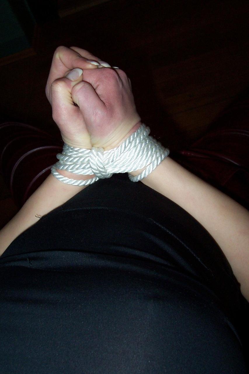 16P Brunette chick finds herself gagged and bound in leather pants on the stairs