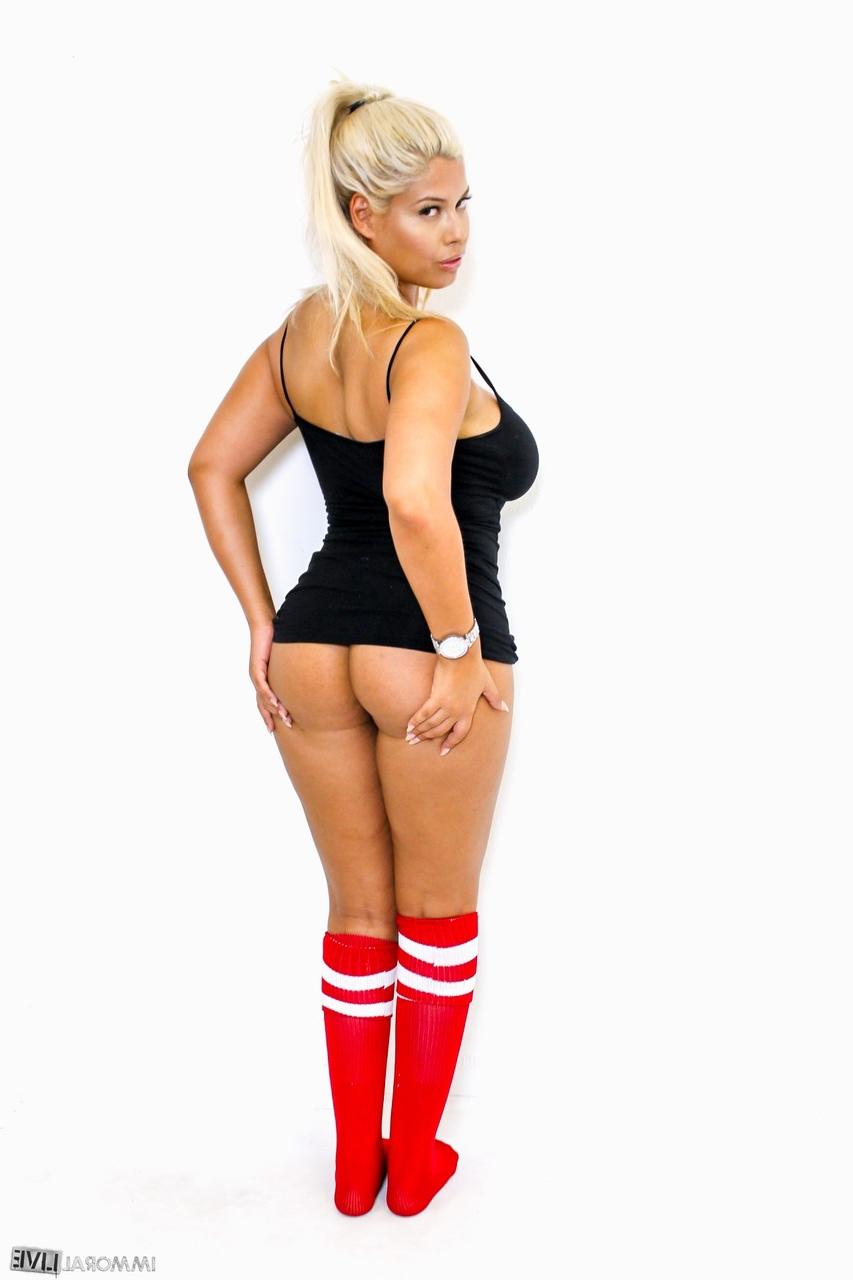 15P Blonde bombshell Bridgette B looses her large boobs while wearing sports socks