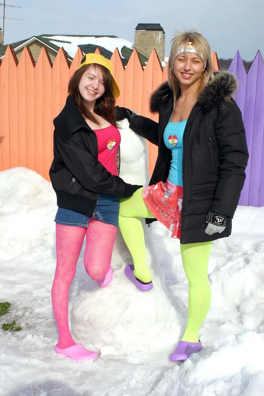 20P Sweet lesbians Anita D and Maya D flash their asses while making a snow dick