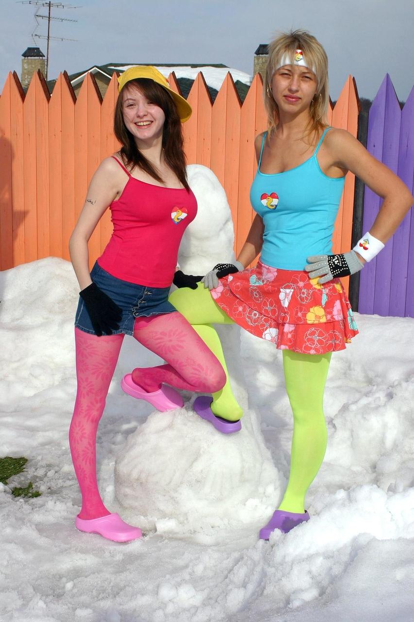 20P Sweet lesbians Anita D and Maya D flash their asses while making a snow dick