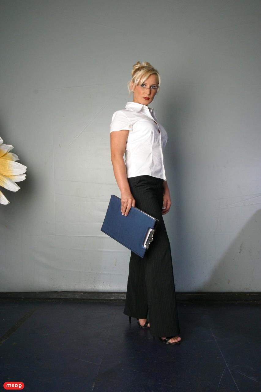 15P Blonde German teacher Magda posing in her sexy uniform at the office
