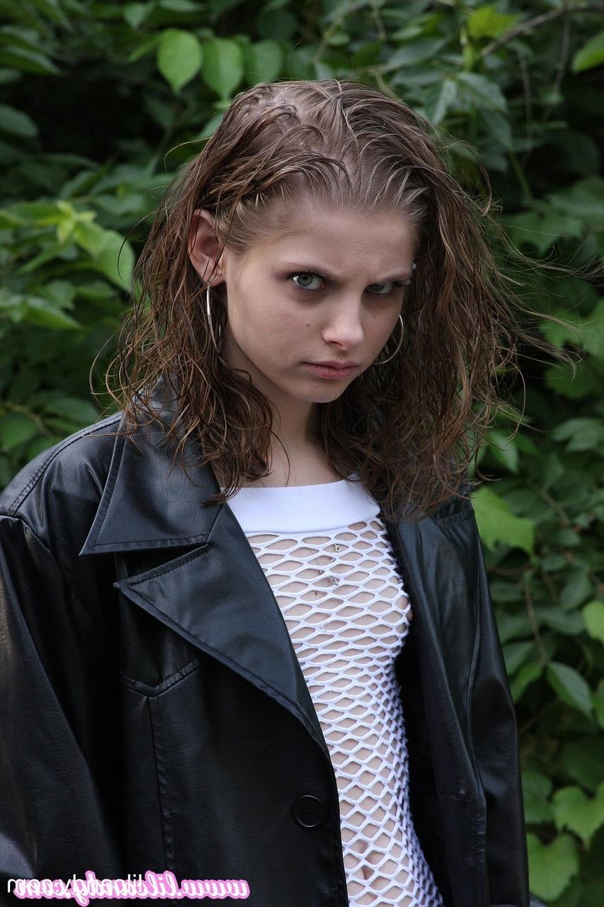 16P Sexy babe Lil Candy poses bottomless in her sheer top & leather jacket