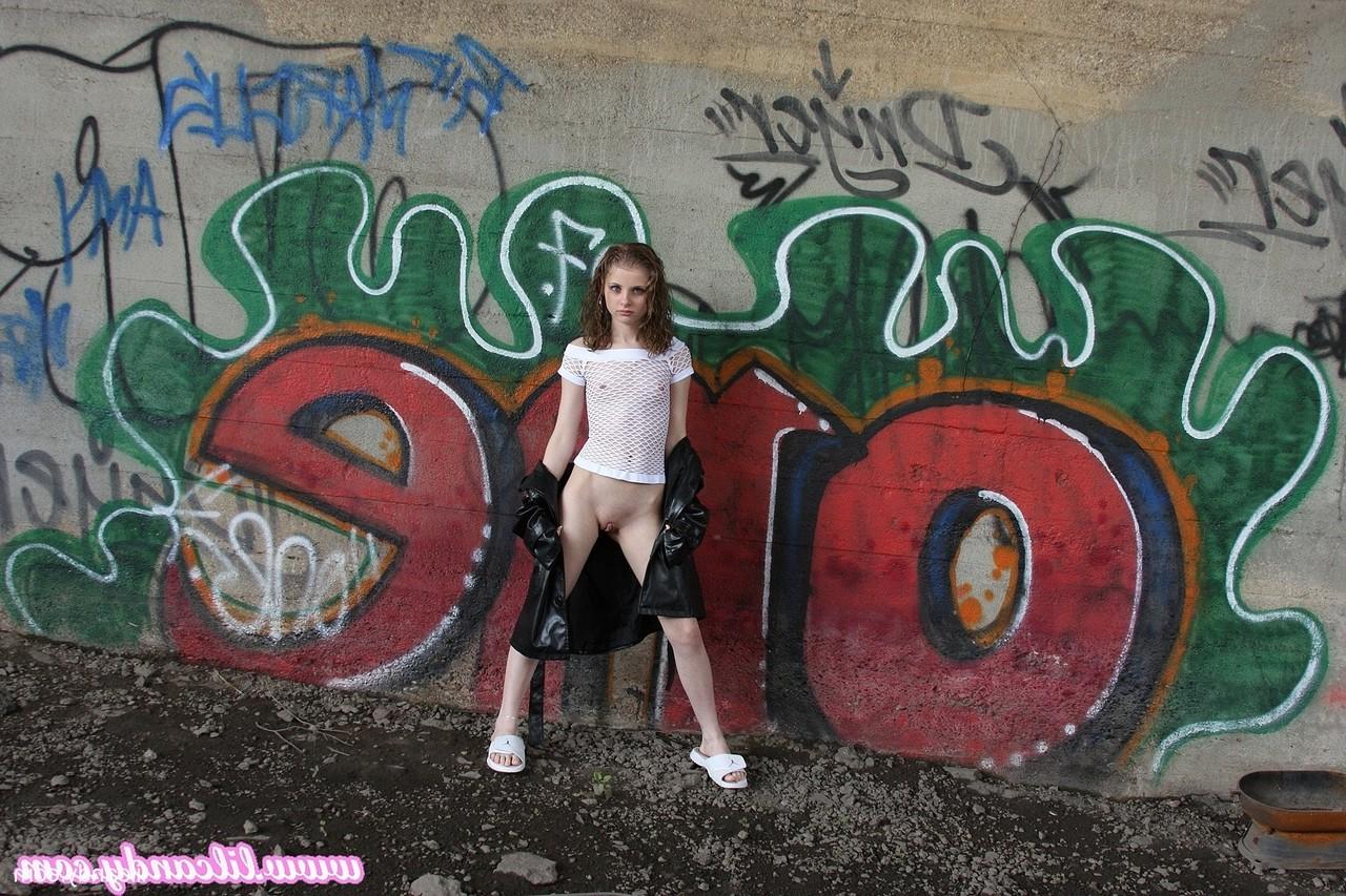 16P Sexy babe Lil Candy poses bottomless in her sheer top & leather jacket