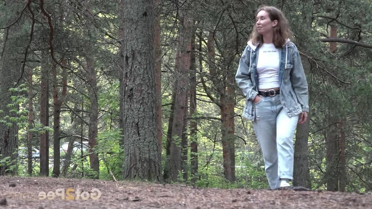 15P Beautiful girl Rita gets caught with her pants down while peeing in the woods
