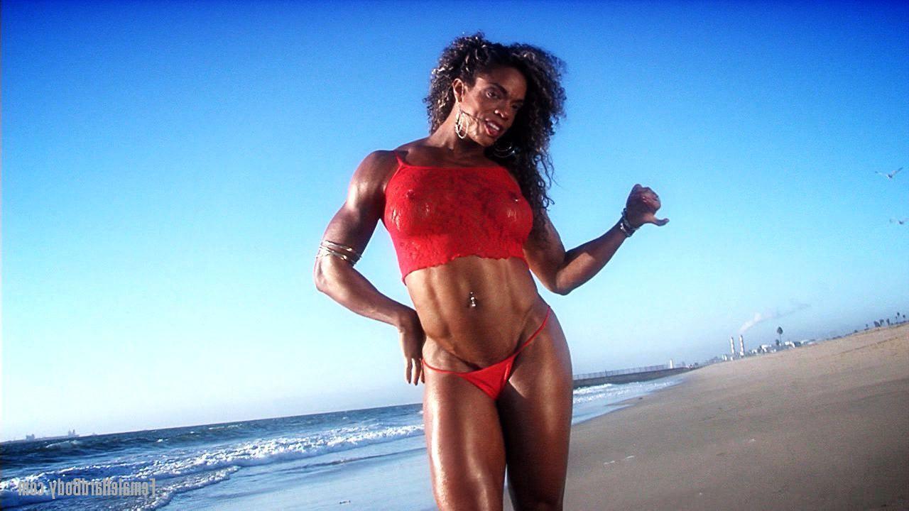 20P Bodybuilder Alexis Ellis flaunts her pierced stomach and hot ass on the beach