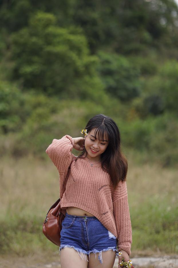 20P Beautiful Asian model poses in her sweater and jean shorts in public