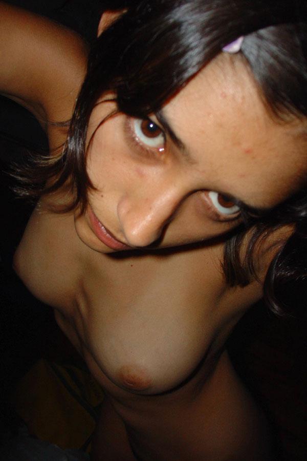 10P Pretty Indian girl is captured in the nude during candid action at home