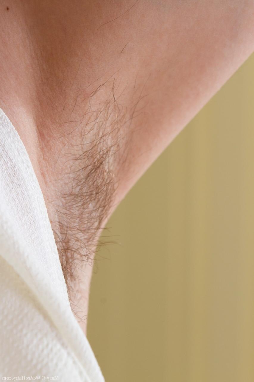 19P Slender mature with hairy laegs does striptease to reveal her shaggy muff