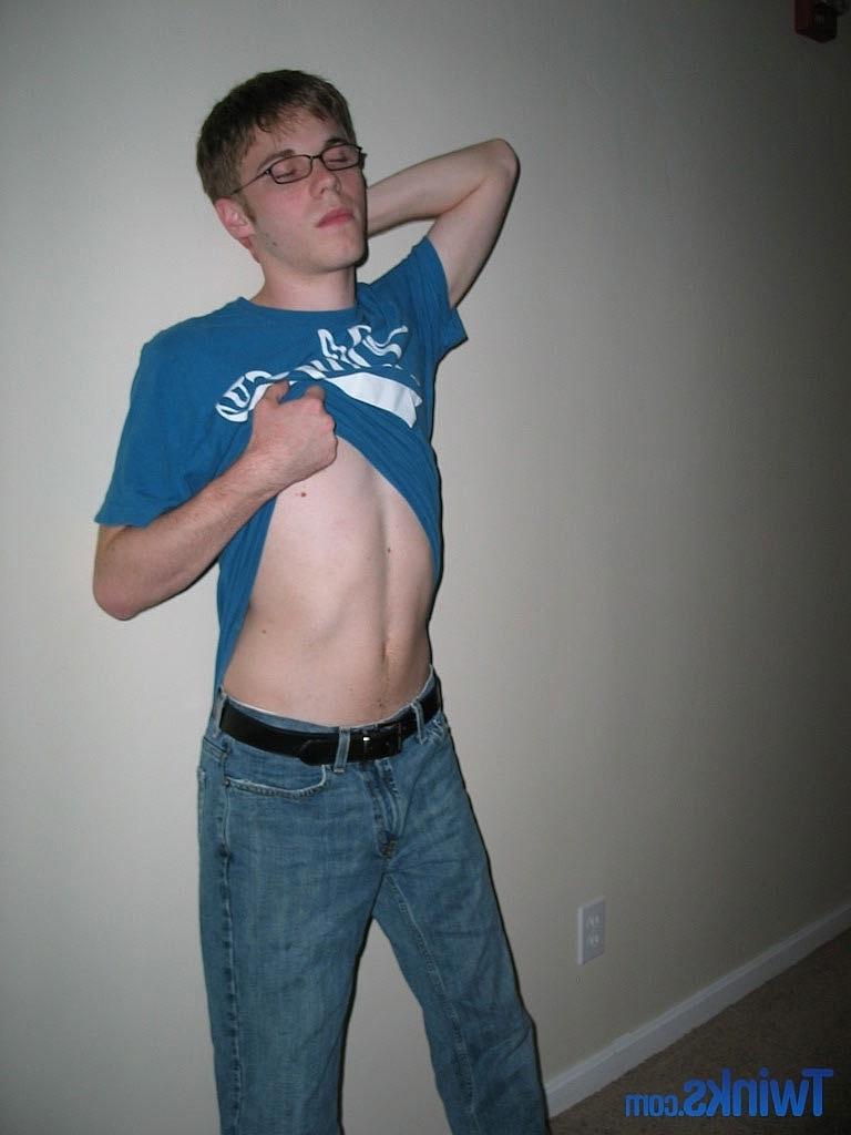 20P Nerdy twink Billy Gee loses his shirt and jeans and jerks off his massive dick