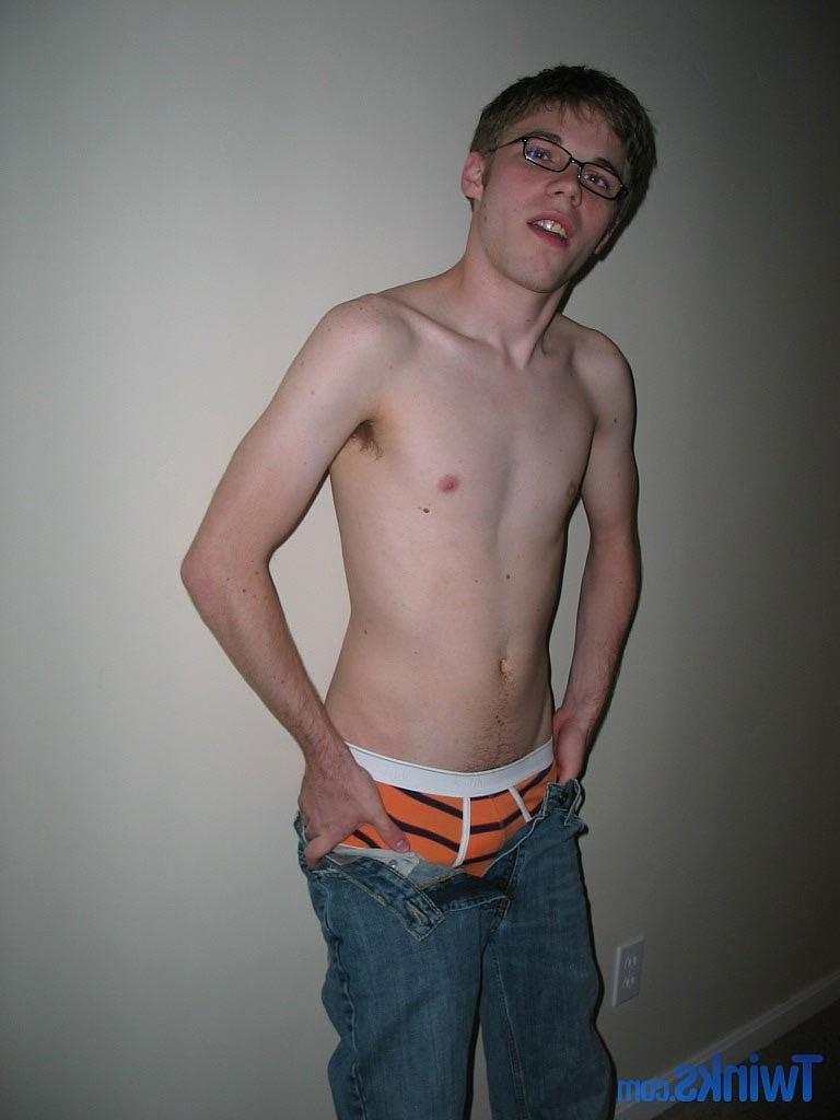 20P Nerdy twink Billy Gee loses his shirt and jeans and jerks off his massive dick