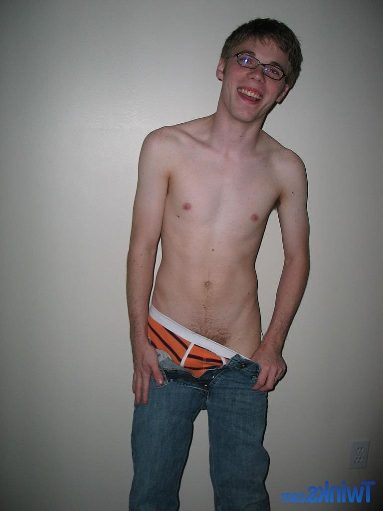 20P Nerdy twink Billy Gee loses his shirt and jeans and jerks off his massive dick