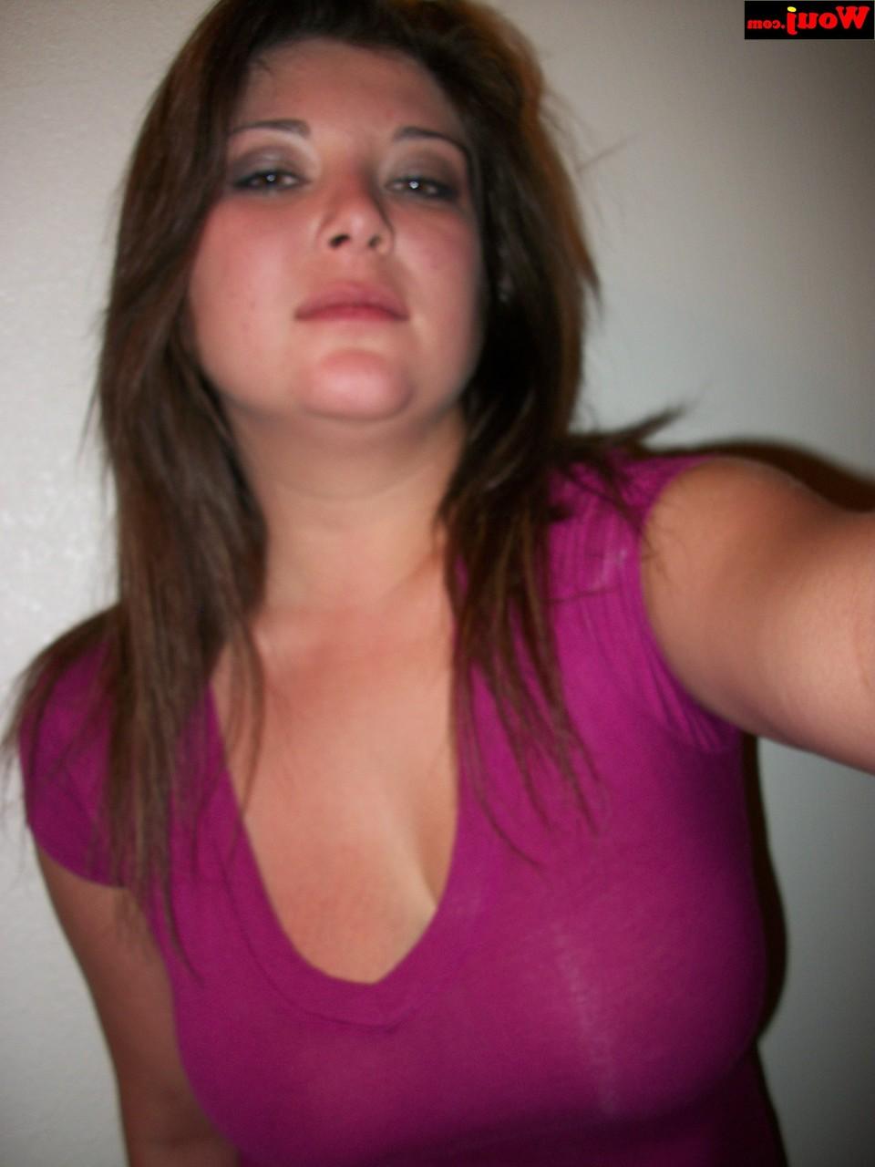 15P Brunette amateur WouJ flaunts her cleavage wearing a shiny pink dress